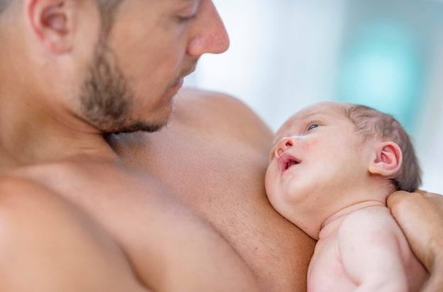 a person holding a baby